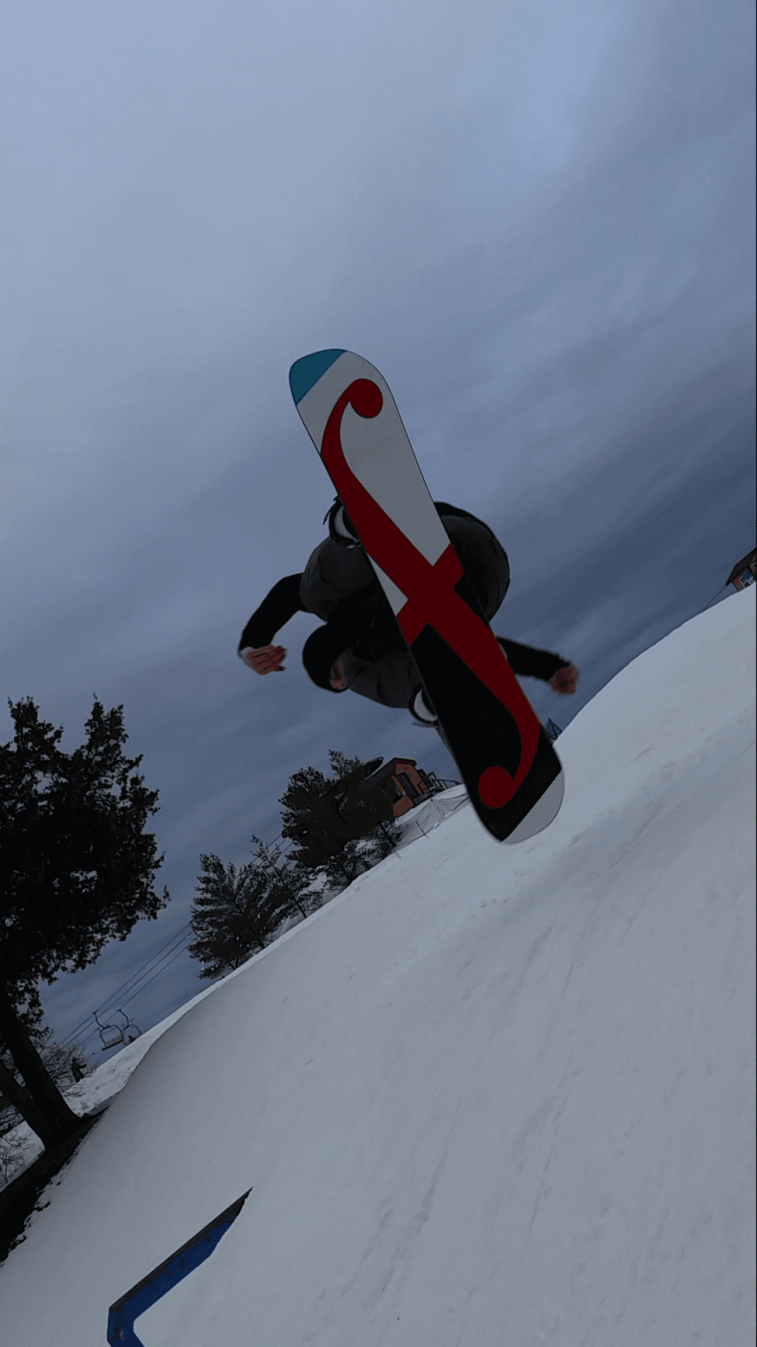 Image of Jordan Ready on a snowboard mid air performing a cork 540 trick